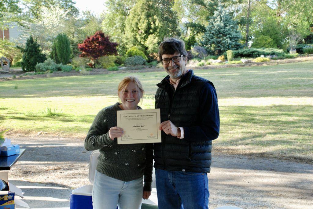Christina Greer being presented the Outstanding Graduate Student Award by Chris Clark, Department Head