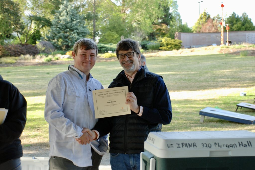 Hence Duncan being presented the Outstanding Undergraduate Student Award by Chris Clark, Department Head