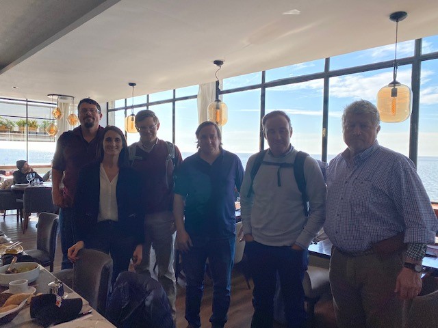 Jon Walton, Chris Boyer and Aaron Smith with representatives in Argentina