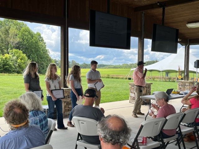 Cameron Jeske receiving award for his poster submission at the 2022 Steak and Potatoes Field Day