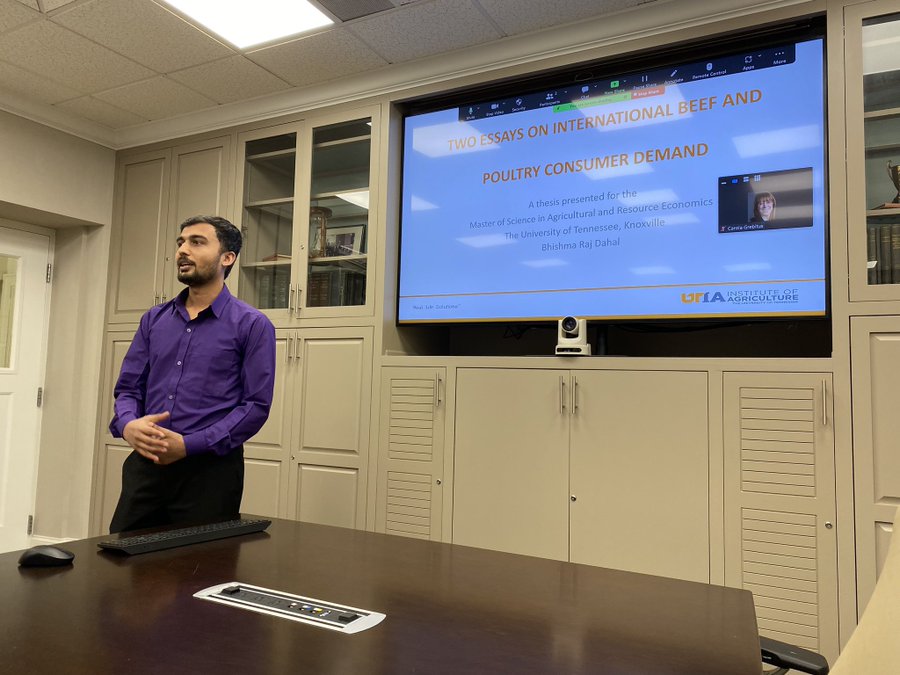 Graduate student Bhishma Dahal presenting in his thesis defense