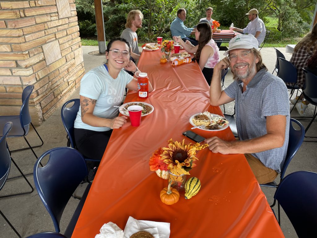 Faculty and students enjoying food and fellowship at the department's Fall picnic