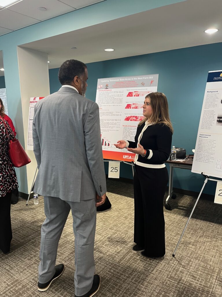 Summitt Wright presenting her poster at the Posters at the Capitol event
