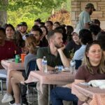 Students, faculty and staff enjoying the picnic