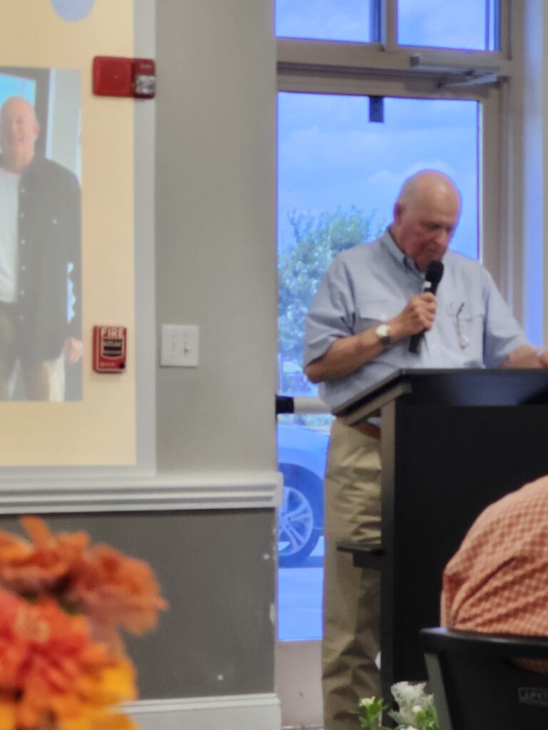 Emmit Rawls reading poem at Kevin Ferguson's retirement reception